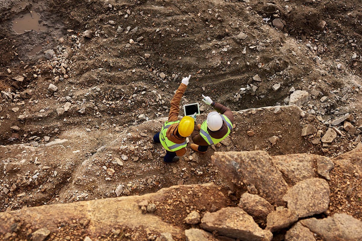 Arial View of Two Mining Employees With Tablet